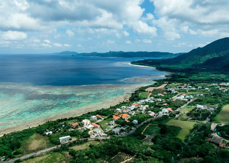 Aerial view of the sea and village in Kabira Yamahara, Ishigaki Island
